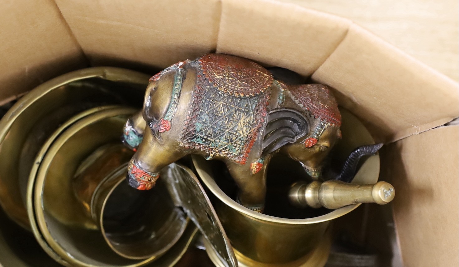 A collection of Middle Eastern copper and brassware, including two large Arabic Dallah